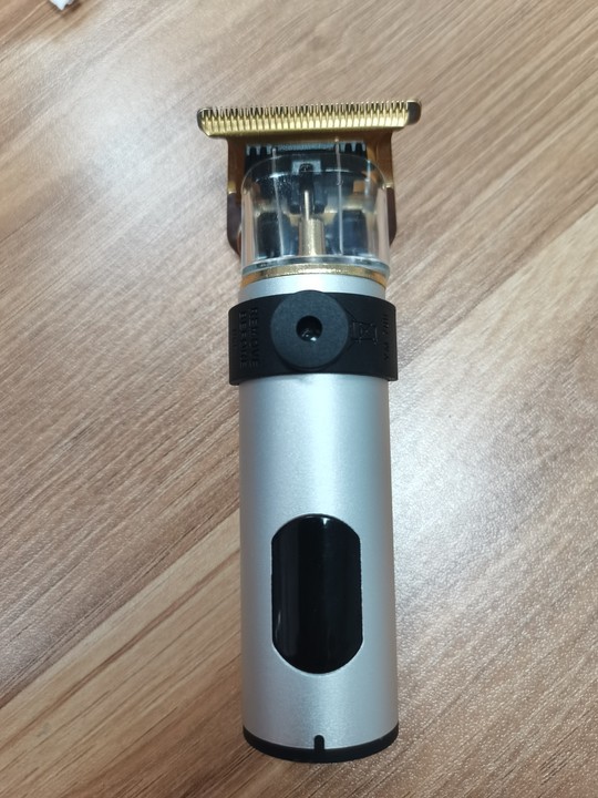 Corte de pelo eléctrico transfronterizo al por mayor retrógrado tallado impulsor eléctrico cabeza baldía de aceite impulsor eléctrico cortadora de plástico afeitar