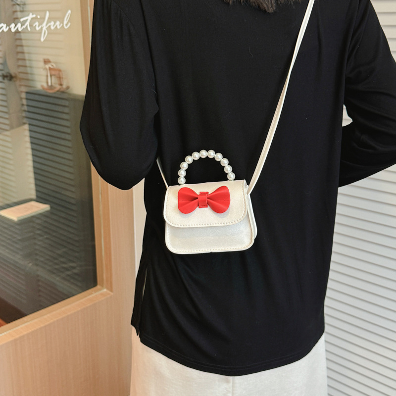Bolsos para niños arco extranjero mini lindos bebés mochilas bolsos de perlas dulces bolsos de hombro para padres e hijos