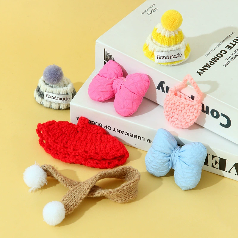 Small cute knitted hat, scarf with bow, small bag, pack, accessory
