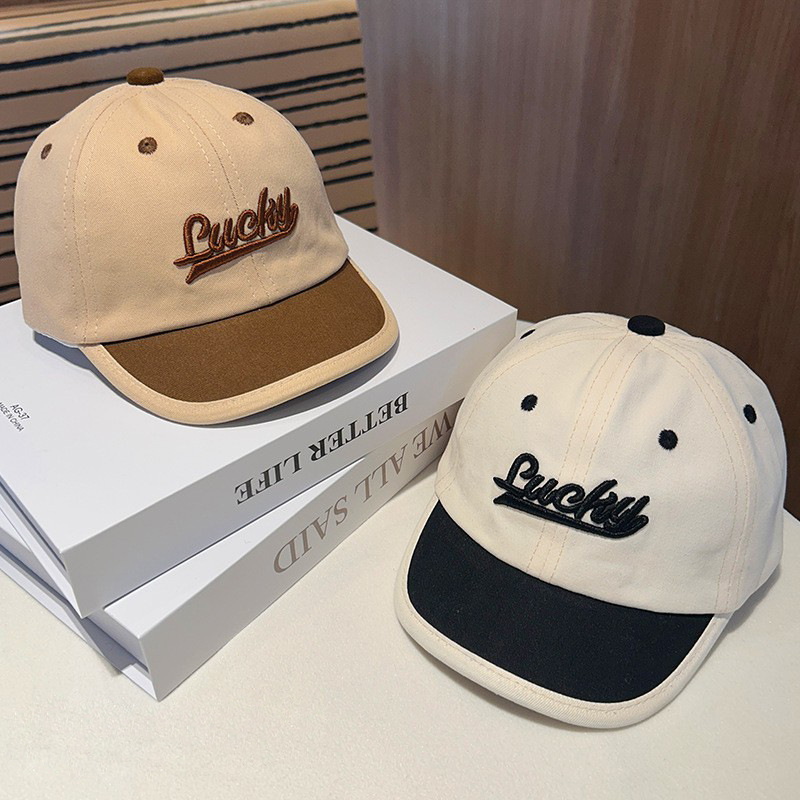 Sombrero de bebé primavera y otoño letras extranjeras sombrero de lengua de pato para niños otoño y invierno caliente sombrero de sol bebé marea de béisbol