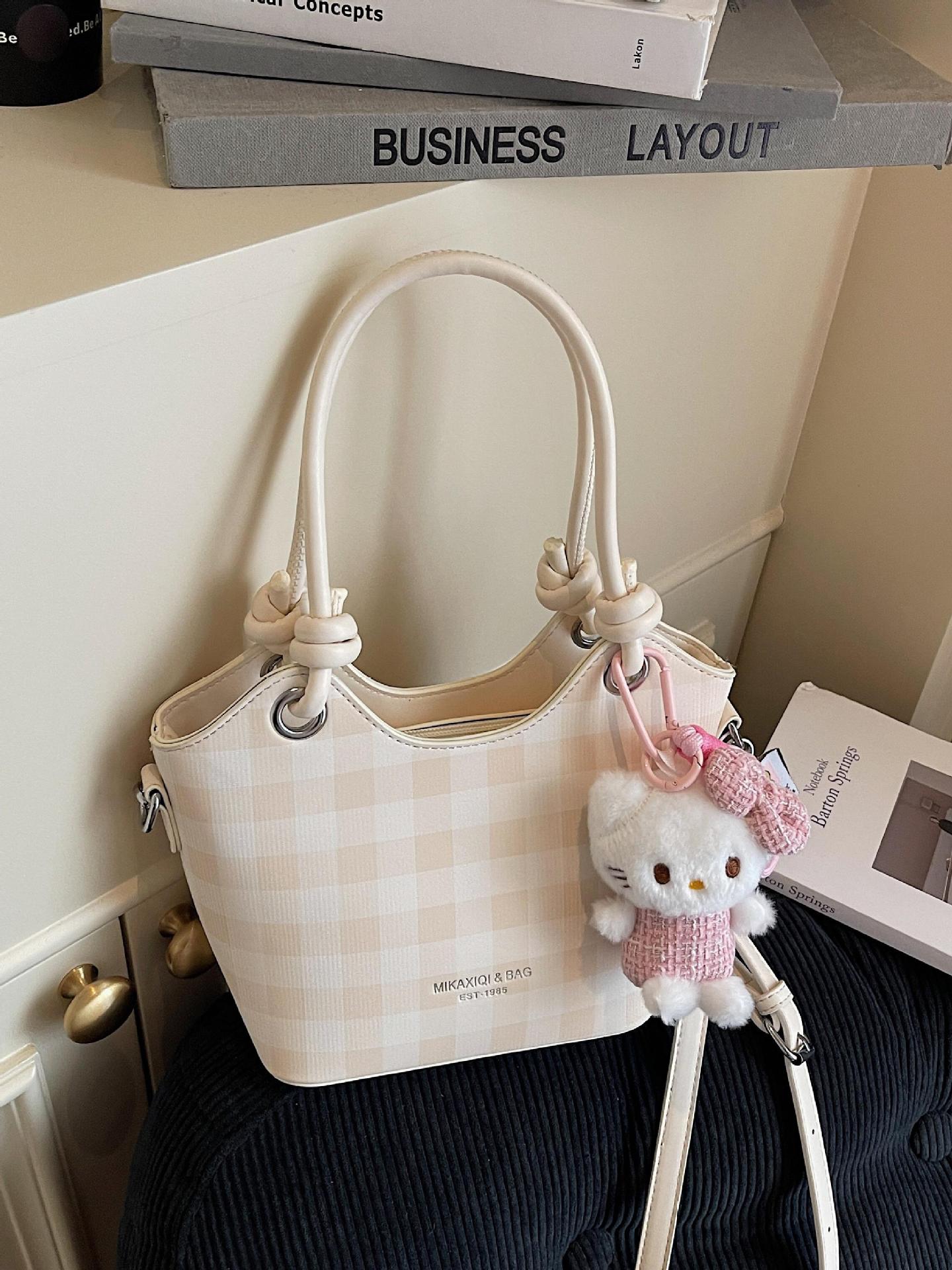 Bolsa de cubo de nicho a cuadrillas 2025, nuevo bolso de mano transfronterizo versátil de alta calidad, mochila de hombro de moda