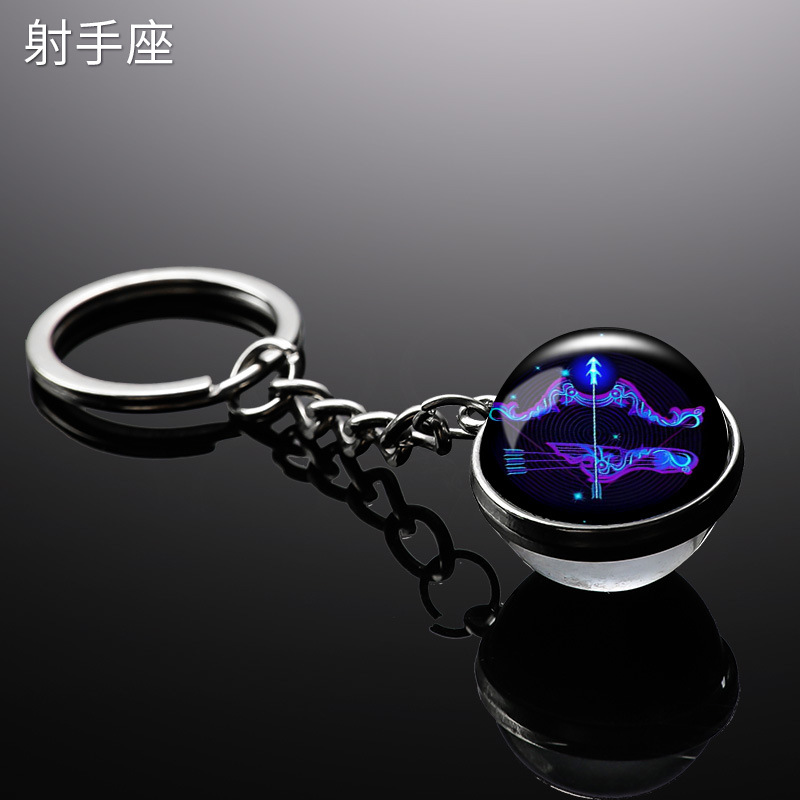 Transfronterizo 12 constelaciones de luz nocturna bolsos colgantes de bolsas de joyas de tiempo doble cara bola de vidrio llavero al por mayor