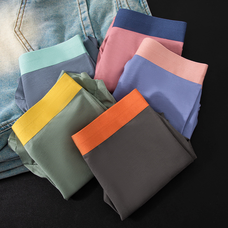 Pantalones de moda de color contrastante, delgadas y sin marcas de cintura media, pantalones de pierna suaves y cómodas, pantalones de entrepierna transpirables para hombres.