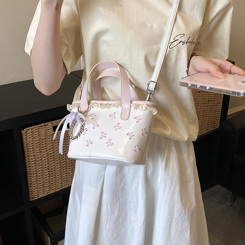 Hermoso arco bordado bolso de cubo de agua dulce encaje bolso de mano de niña nueva bolsa de niños transfronteriza
