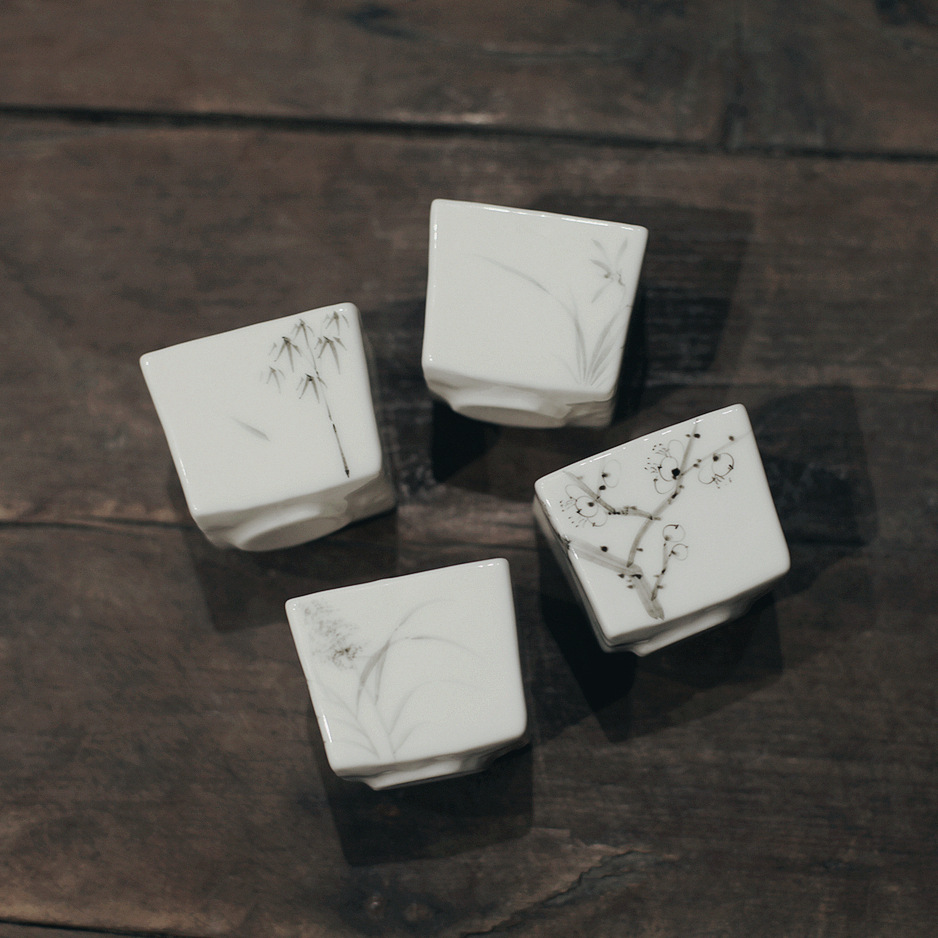 Artesanos de manteca de cerdo blanco taza cuadrada tinta pintada a mano taza de té cuatro caballeros taza de té literatos utensilios de té