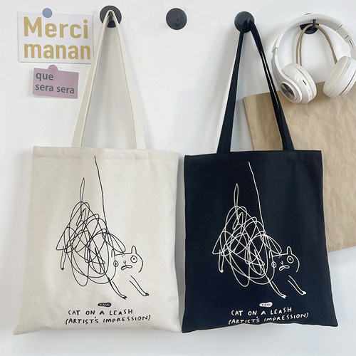 Niche personality graffiti design cute cat one-shoulder canvas bag women's summer portable commuting bag