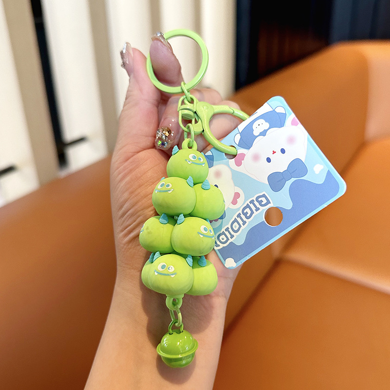 Popular en línea rojo creativo monstruo de dibujos animados jengle lindo mochila colgante coche llavero pareja pequeño regalo