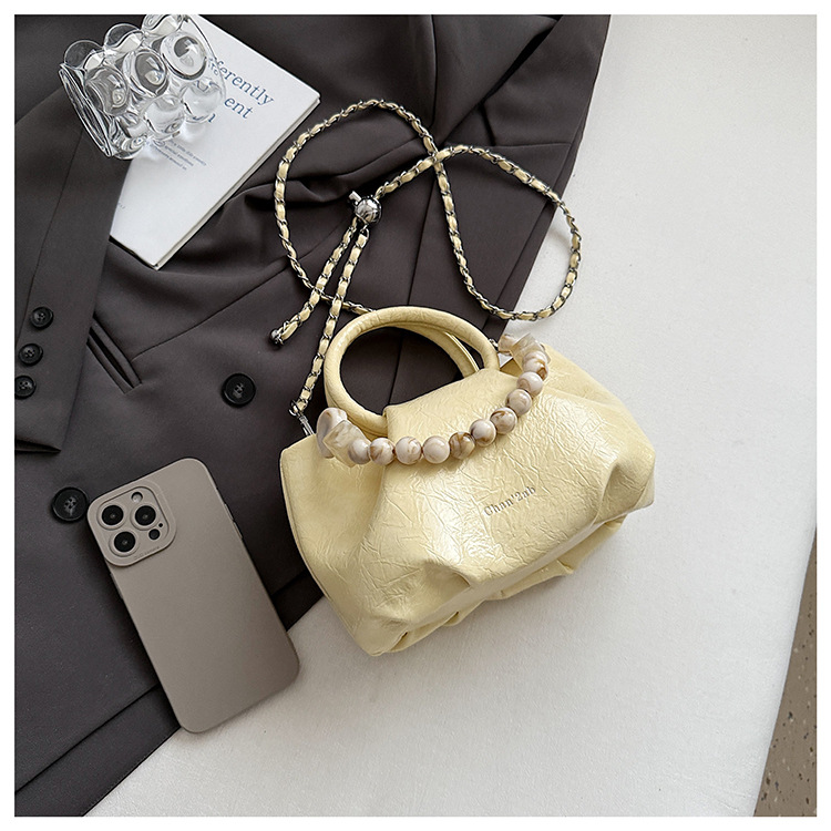 A stylish and trendy beaded bag for women, a new summer chain crossbody cloud bag for women in 2025 undefined