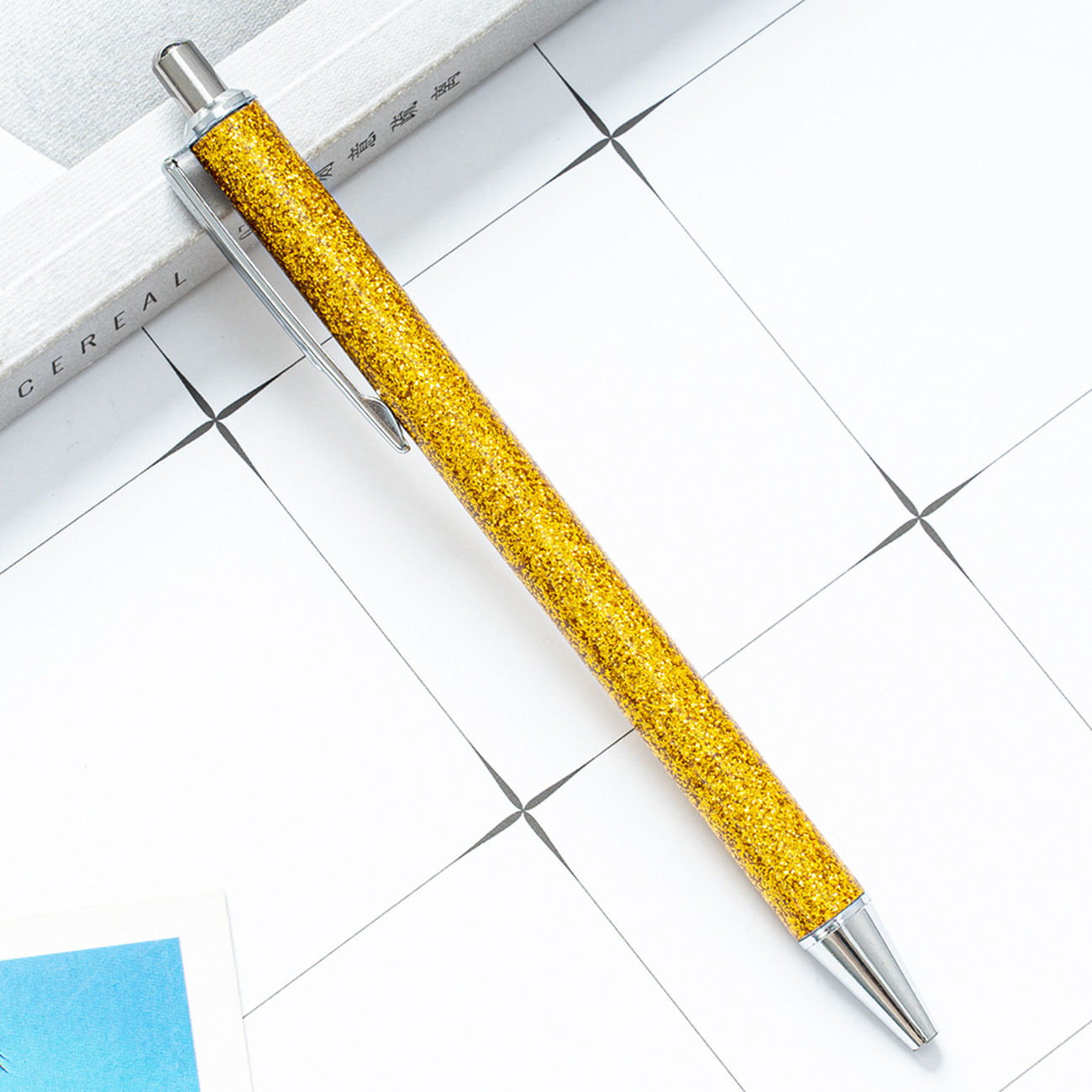 Presione el bolígrafo de aceite de metal creativo polvo de oro sequinado logotipo de impresión de regalos bolígrafo multicolor al por mayor