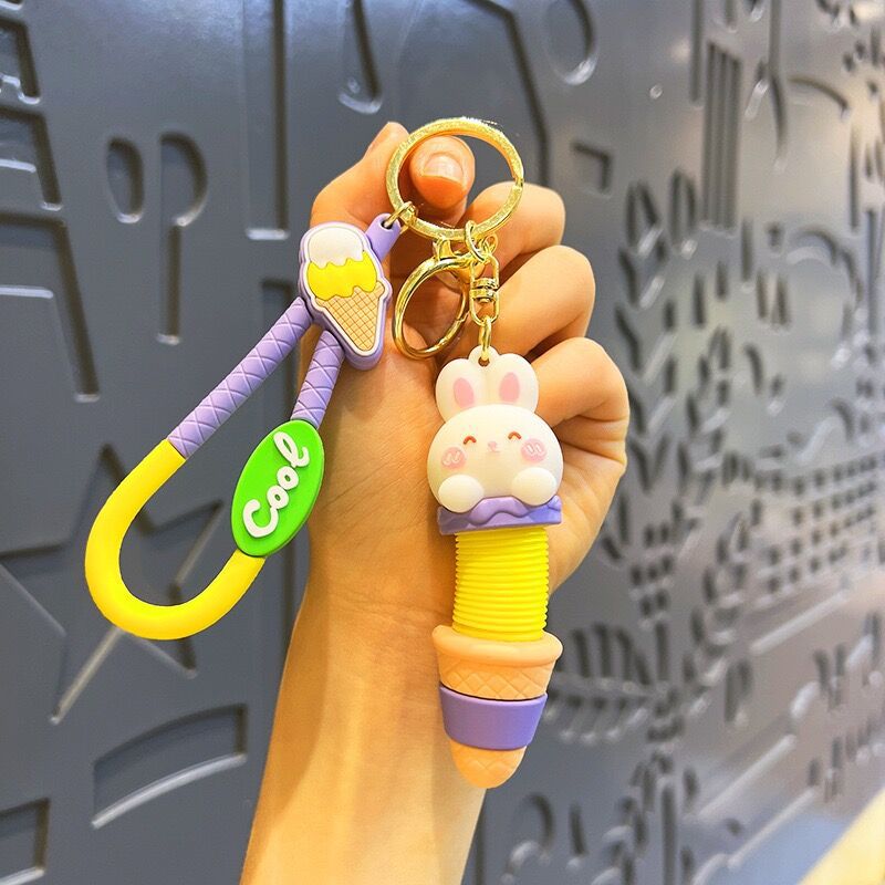Llavero de cuello telescópico creativo de dibujos animados Divertido colgante de bolsa de descompresión colgante de coche cadena anillo pequeño regalo al por mayor