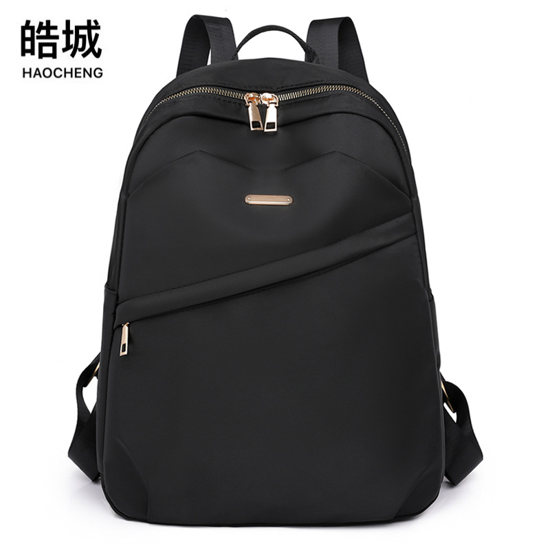 2023 verano nuevo estilo casual damas mochila de nailon simple literatura al aire libre mochila de viaje ligero mochila escolar al por mayor