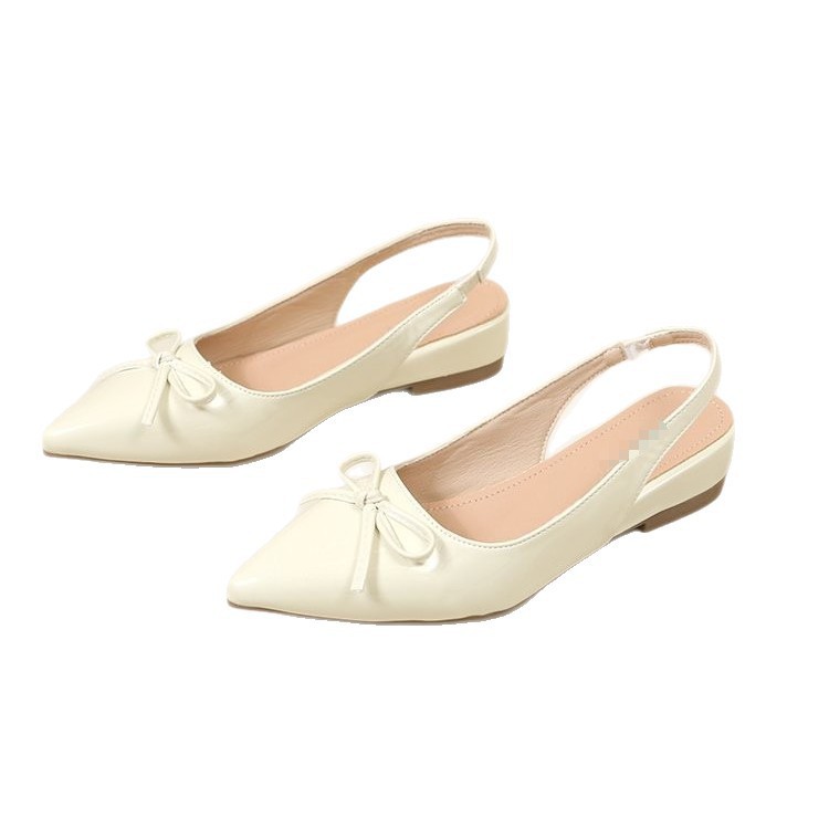 Zapatos de tacones planos transpirables para mujeres verano 2026 nuevo arco de estilo francés detrás de zapatos vacíos sandalias de punta para mujeres