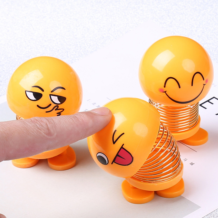 Tiktok mismo estilo sacudiendo cabeza expresión facial bolsa muñeca personalidad creativa Smiley cara coche primavera estudiante Escuela Primaria Decoración