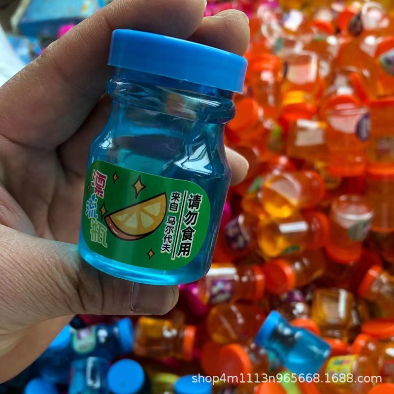 Venta al por mayor y al por menor de pegamento de burbujas de 24 piezas, pegamento M de agua falsa popular en Internet, pegamento de burbujas transparente, pegamento de piel de arena, lodo de cristal.