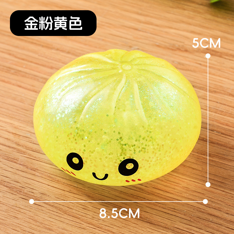 Comercio exterior transfronterizo explosivo dibujos animados sonrientes descompresión pulpa de fruta bola de oro en polvo vapor caja de color simulación bolón pellizco pellizco reducción de presión