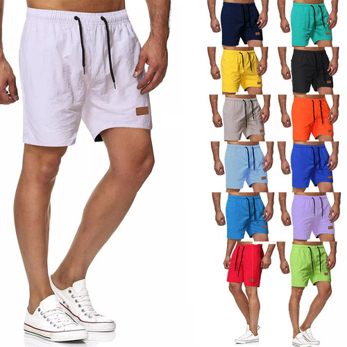 Men's all-matching five-minute quick-dry solid color leather label beach pants, sports fitness shorts