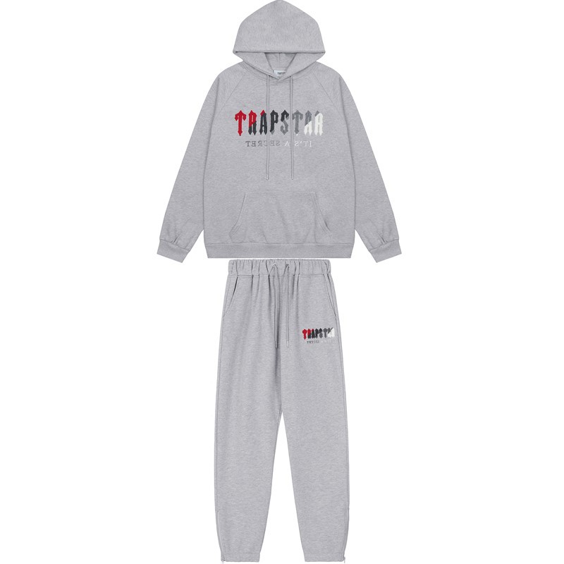 Marca de moda europea y americana Trapstar rojo gris toalla bordado más terciopelo pareja de hombres calle principal suéter casual pantalón traje