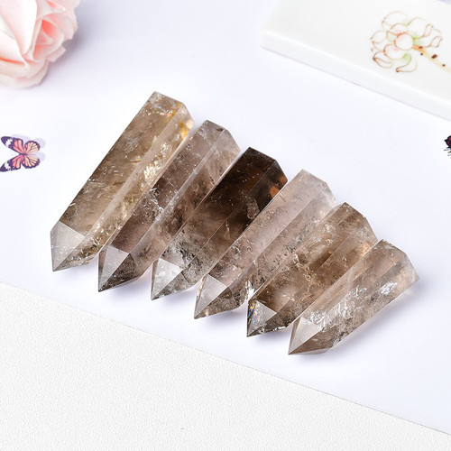 Cross-border hot-selling natural tea crystal column single-pointed hexagonal prism raw stone polished smoky crystal column home office Feng Shui ornaments