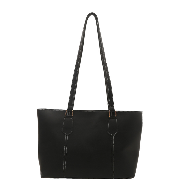 Bolso de viaje de alta gama retro 2025 primavera nuevo estilo salvaje ins color sólido bolso de hombro de trabajo bolso Tote