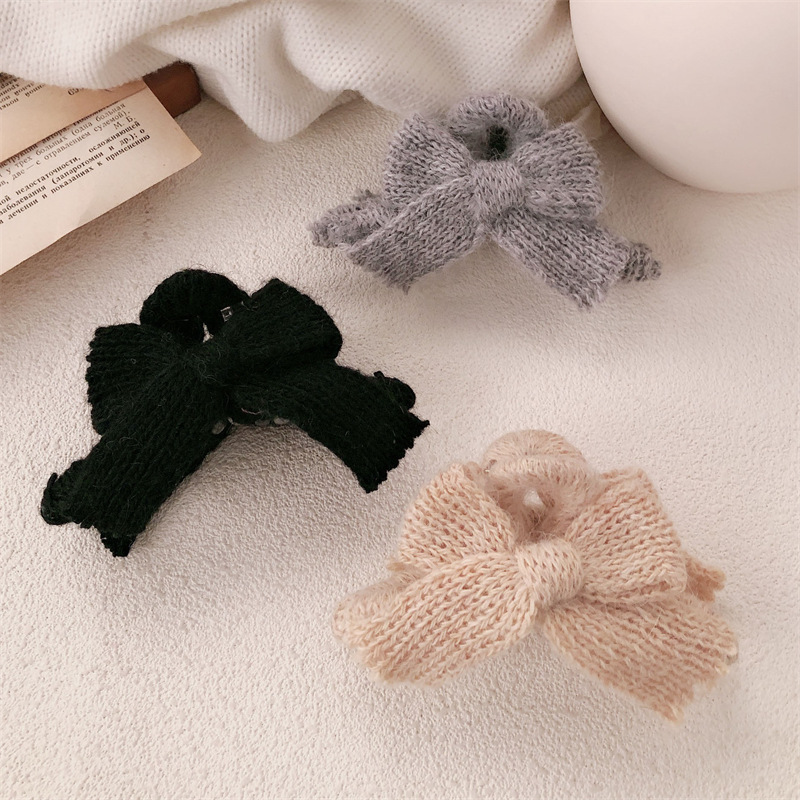 Otoño y invierno nuevo arco lana de punto pinzas de cabello de alta sensación otoño y invierno tocado de Año Nuevo rascar pinzas de pescado para mujeres