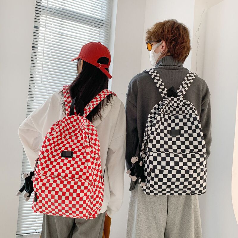 A generation of Vance leisure backpack street trend black and white checkerboard sports backpack men's and Women's Student schoolbag