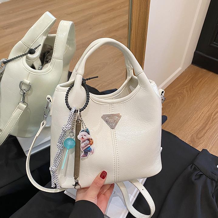 Bolsa de cubo de mano explosiva de comercio exterior para mujeres 2025 nueva moda bolsa de hombro ocio para viajar al trabajo de alta calidad bolsa madre