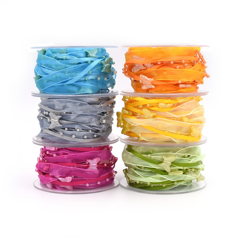 Nuevo transfronterizo primavera mariposa cadena de cuentas decoración cinta de mano material de jardinería de poliéster tejido a mano cinta