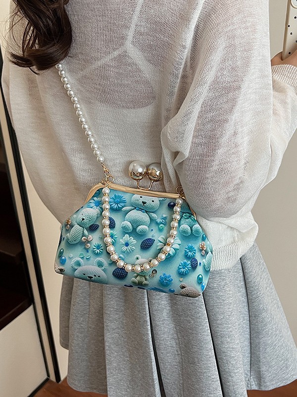 Bolso de mujer 2025 nueva impresión de tela lindo oso bolsa de cena concha de cadena de perlas bolso de mochila