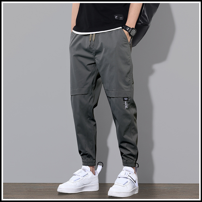 Ropa de trabajo de primavera y otoño pantalones largos pantalones casuales de los hombres pantalones sueltos atados al tobillo marca de moda de primavera y verano Pantalones deportivos delgados