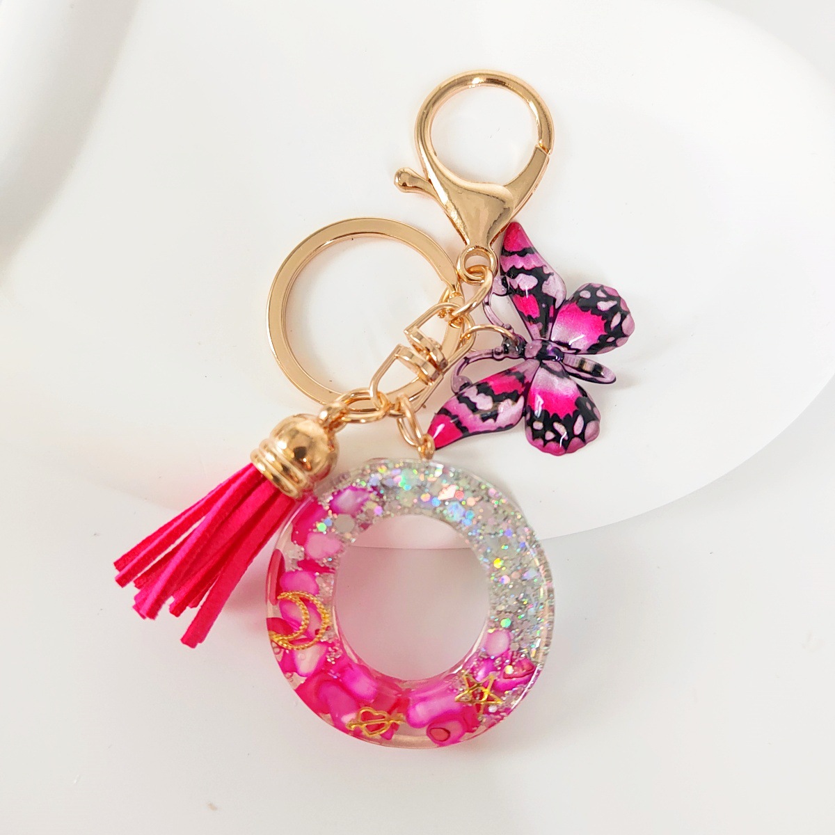 Inventario transfronterizo nueva resina bicolor mariposa borda llavero colgante estrella luna accesorios de joyas