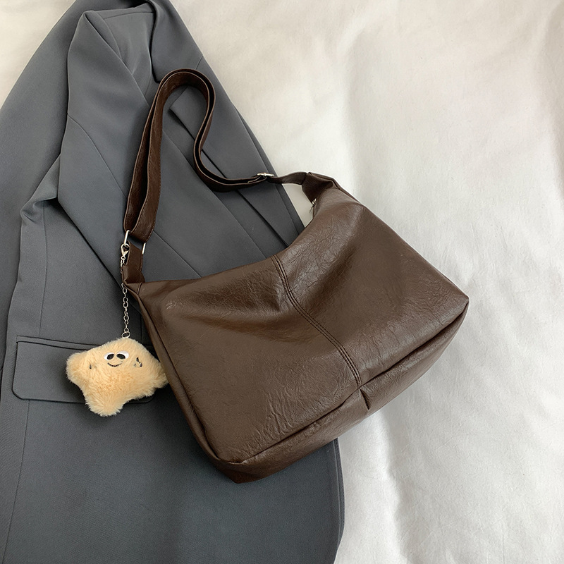 Bolso de cuero suave versátil para damas 2024 nuevo estilo retro moda bolso universitario gran capacidad de ocio