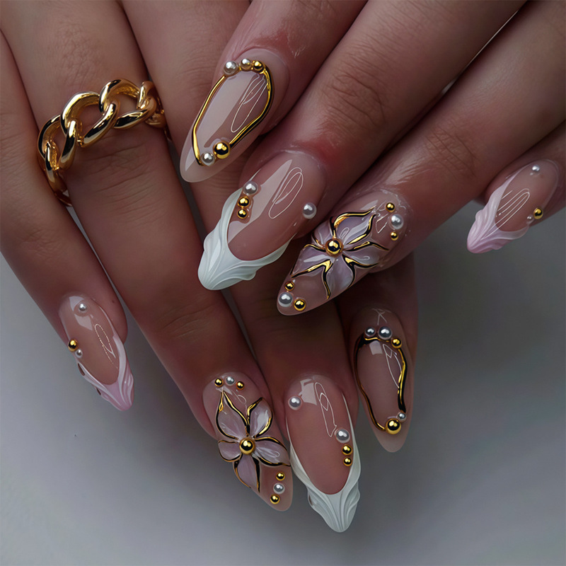 Wearable nails in medium almond shape with 3D embossed gold carving, pearl and steel bead decorations, detachable false nails Wearable nails in medium almond shape with 3D embossed gold carving, pearl and steel bead decorations, detachable false nails
