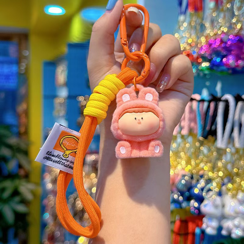 Caricatura floc amarelis llavero de automóvil pareja colgante bolsos creativos colgar garra máquina regalos al por mayor