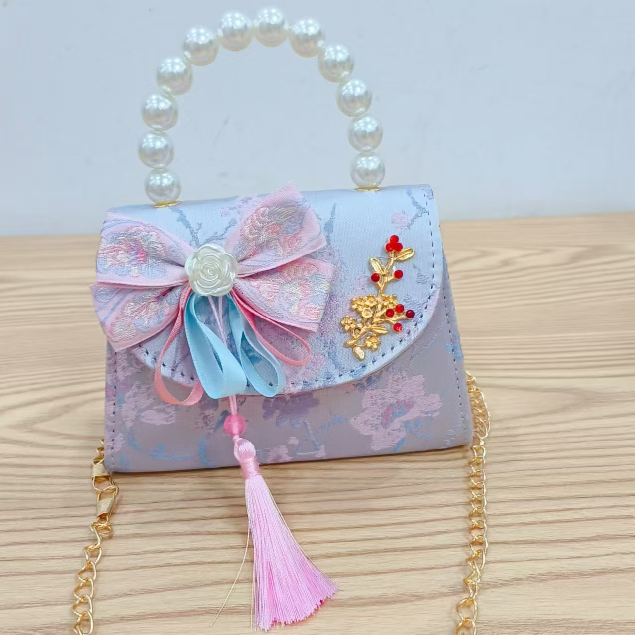 Niños pequeños bolsos de hombro de viento de fragancia de alta calidad exquisita niña antigua bolso de cambio princesa perla bolso de mano