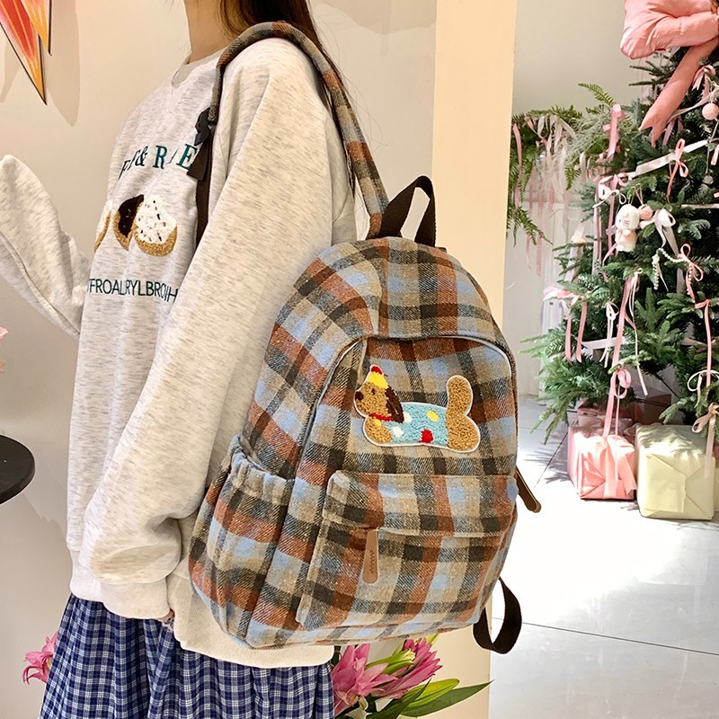 Mochila versión coreana de la versión coreana de la cuadrícula cuadrada de gran capacidad, mochilas escolares para estudiantes de secundaria y secundaria son simples y completas con paquetes de viaje de corta distancia.