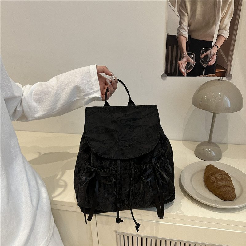 Mochila de lazo de sentido de alta gama para mujer 2025 nueva moda mochila de viaje mochila escolar casual para estudiantes coreanos