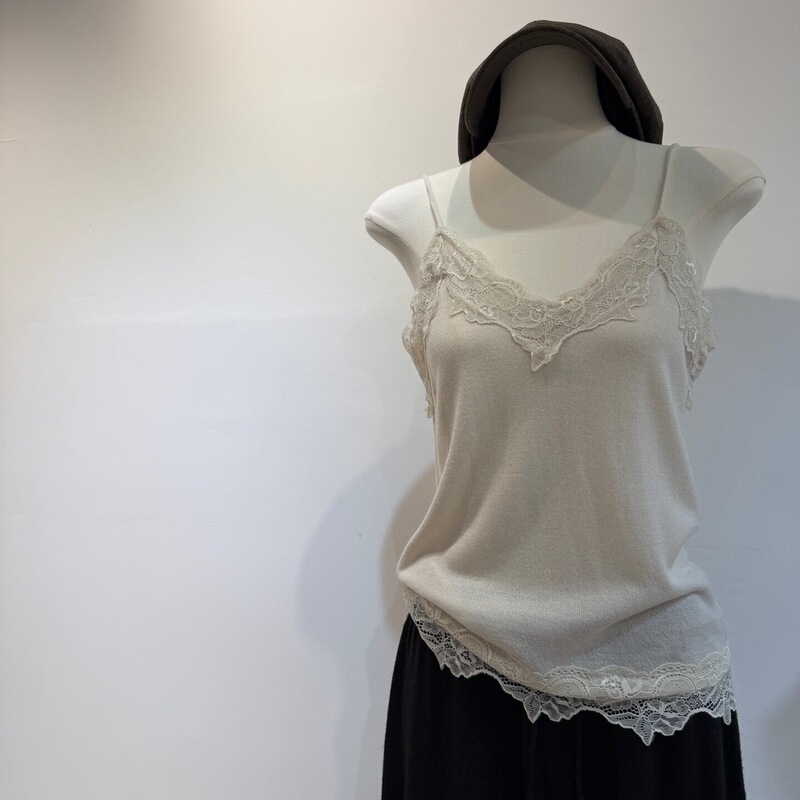 Wool blend French-style lace camisole with thin straps, paired with a lace V-neck tank top Wool blend French-style lace camisole with thin straps, paired with a lace V-neck tank top