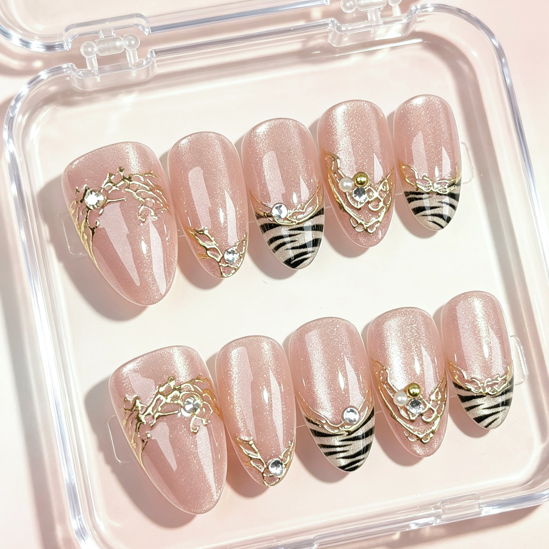 Peach-colored, gold-embossed zebra-patterned French-style press-on nails with wide, cat-eye-shaped rhinestones, a trendy European and American style for cross-border sales and Instagram