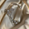 Platinum ear clips with zircon pearl