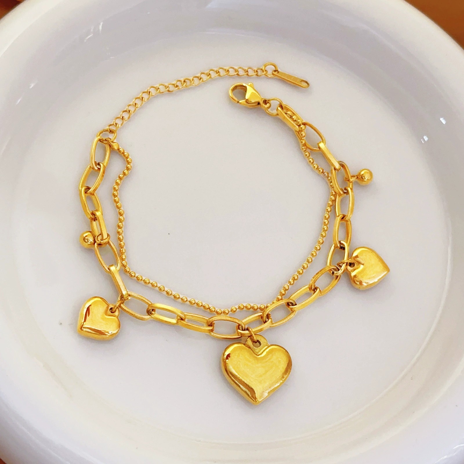 Pulsera de joyería de moda dorada de todo fósforo, lujo ligero, simple, nueva pulsera de acero de titanio que no se desvanece, trébol de cuatro hojas para mujer, transfronterizo