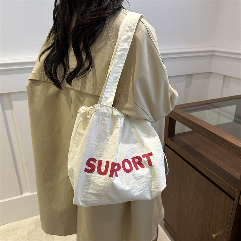 letras coreanas bolsas de lona para mujeres 2024 otoño nuevo relajado bolsas de clase de estudiantes universitarios de gran capacidad bolsas de nylon