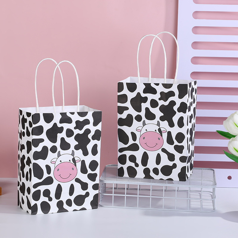 Bolsa de regalo con estampado de vaca en blanco y negro, bolsa de papel portátil, diseño de dibujos animados, regalo para estudiantes, embalaje de dulces, bolsa de papel portátil
