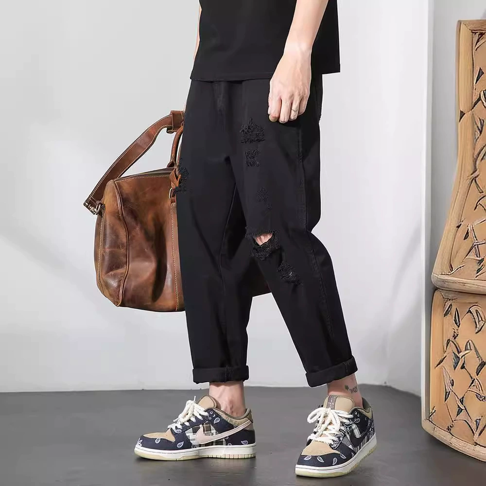 Летняя тенденция черные дырки джинсы мужские свободные девятиукороченные брюки плюс размер прямые брюки Harlen повседневные дикие брюки