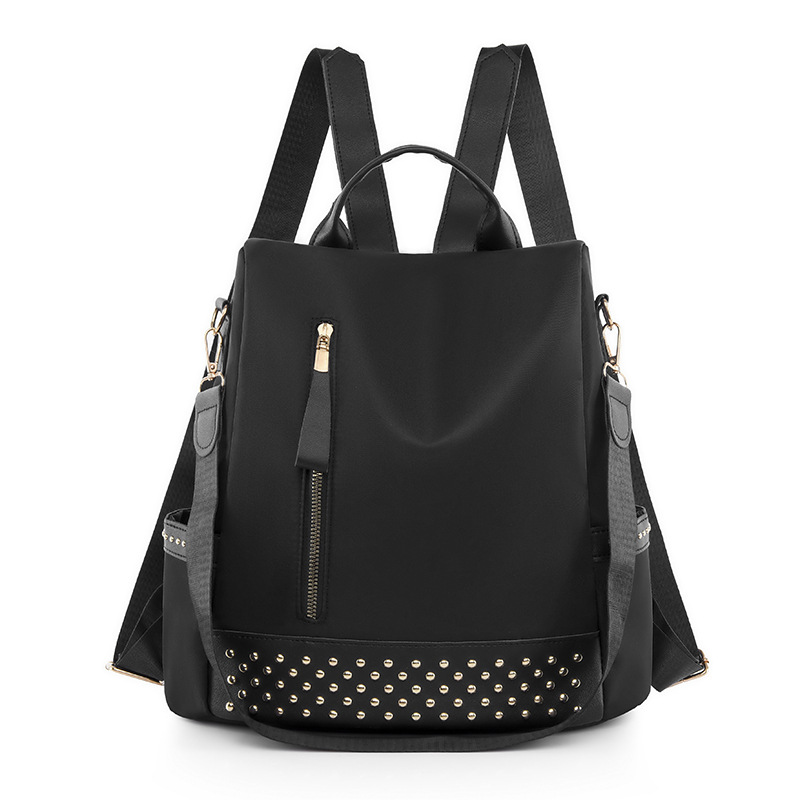 Venta al por mayor 2023 nuevo estilo casual mochila antirrobo mujer simple moda Oxford tela remache mochila escolar de doble uso