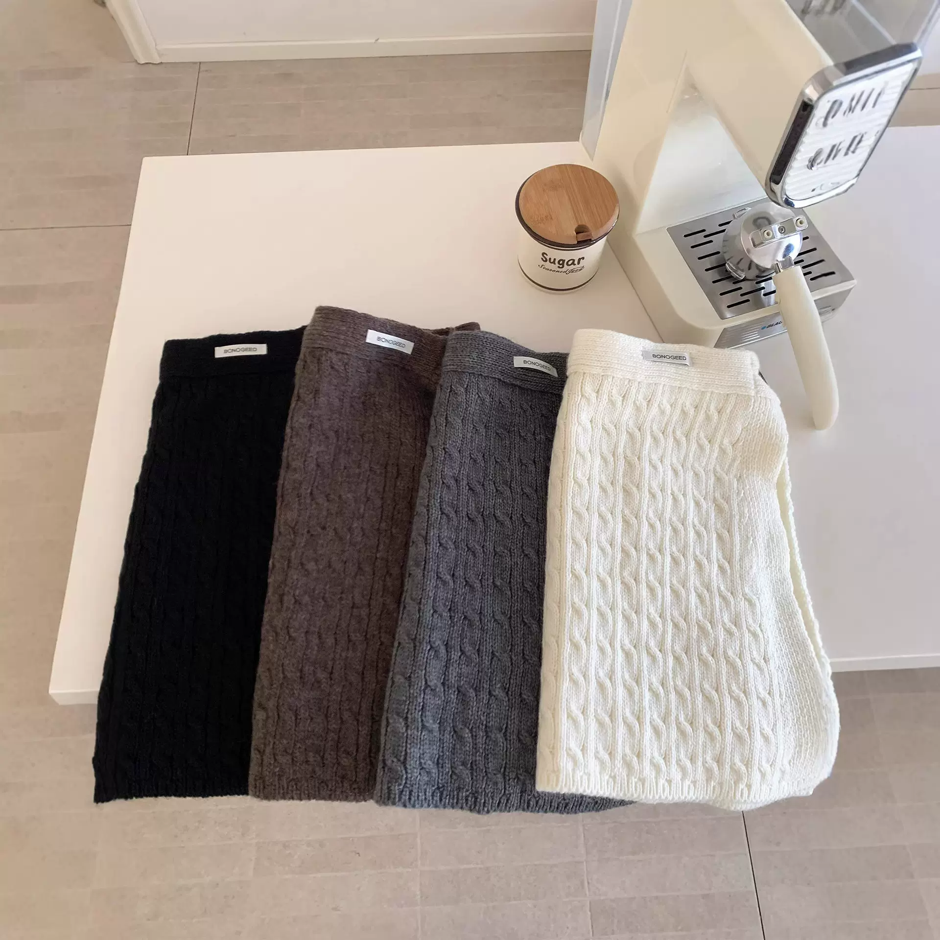 韩系纽扣针织毛线屁帘女新款时尚百搭氛围感保暖叠穿半身裙子批发