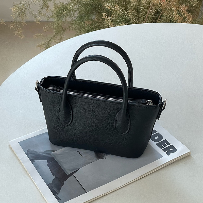 Mini bolsa de cesta de verduras de cuero minimalista 2025 nuevo estilo de piel de vaca Xiaozhong lingote bolso de mensajero portátil bolso de hombro femenino