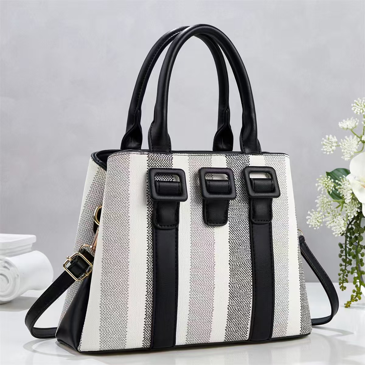 Bolsa de mano casuales a rayas simples temperamento de moda bolsas de hombro de viaje diario versátil mochila bolsas transfronterizas