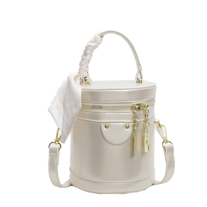 Bolso de cubo popular de este año, nuevo bolso de verano 2025, bolso de hombro de alta gama, bolso de mensajero retro de todo fósforo para mujer