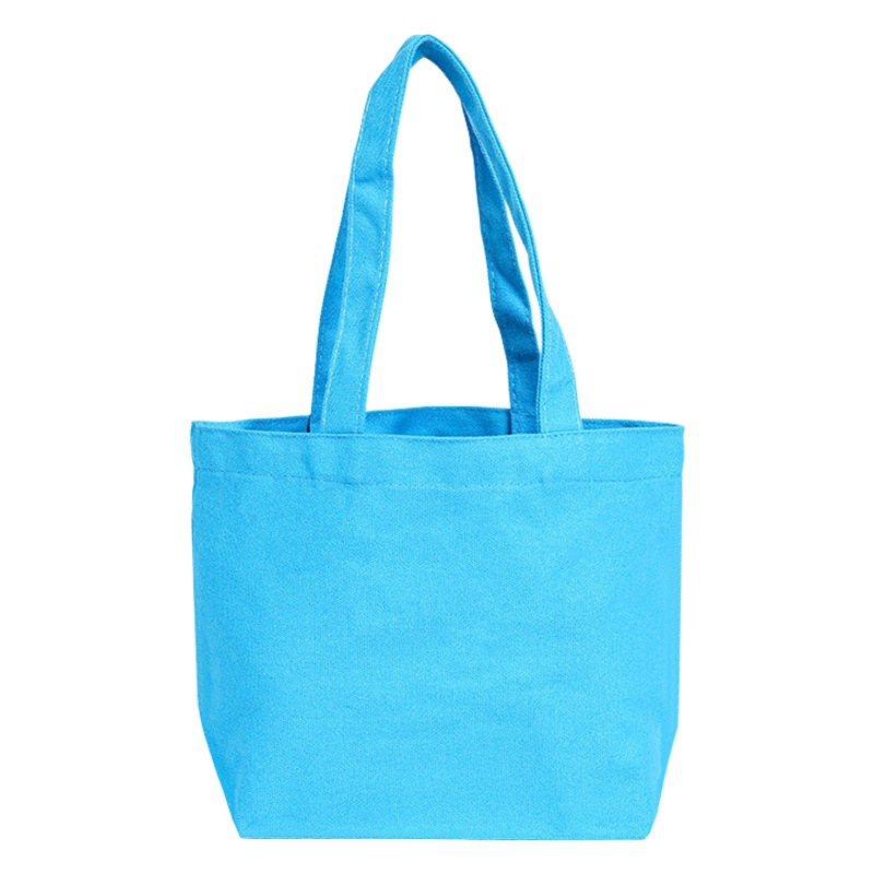 Fábrica al por mayor de algodón en blanco en stock DIY pintado a mano graffiti producción bolsa de lona blanca portátil hombro logo bolsa