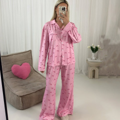 欧米の新型ニットの蝶結びのプリントの長袖のズボンは国境を越えて家の服の女性の快適でゆったりしているカーディガンのパジャマです。